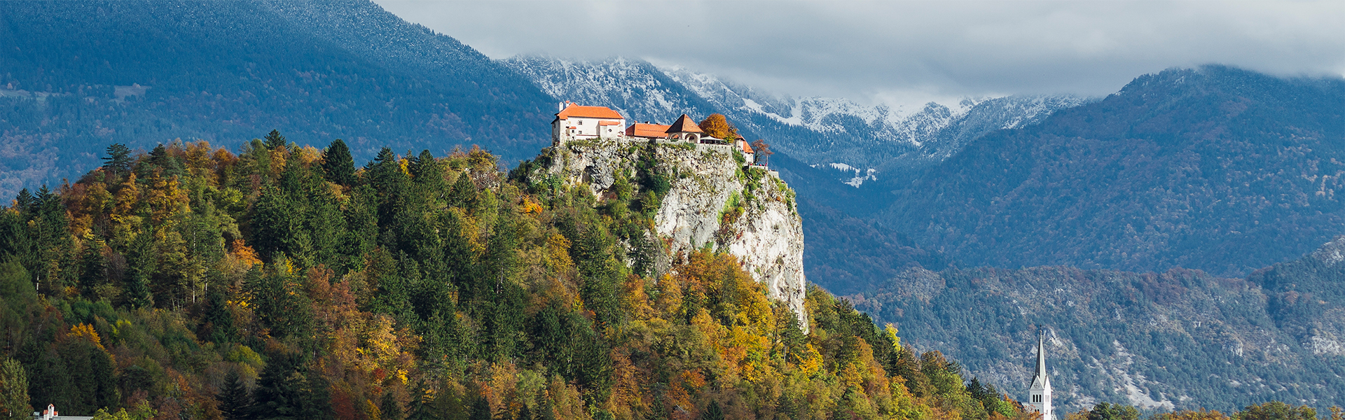 historic castle top hill covered with colorful leaves bled slovenia